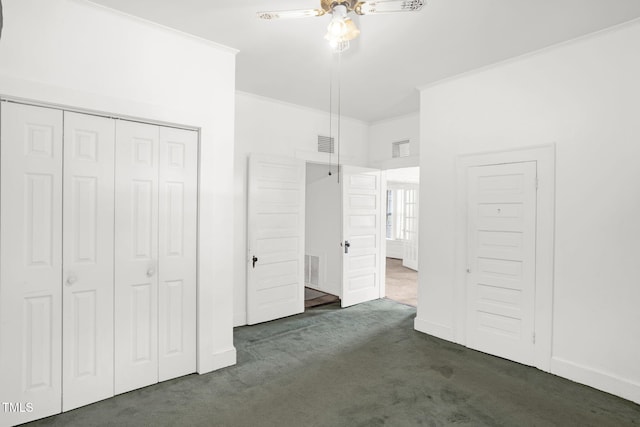 907 Morehead Ave, Durham, NC 27707 - unfurnished bedroom with dark carpet, ornamental molding, a closet, and ceiling fan