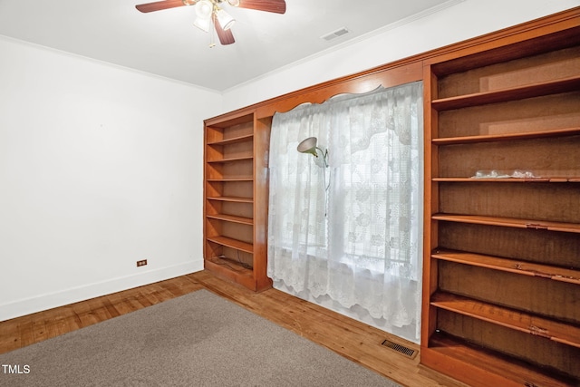 907 Morehead Ave, Durham, NC 27707 - empty room with a ceiling fan, ornamental molding, and wood finished floors