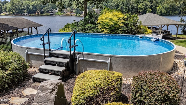 1221 Sagamore Dr, Louisburg, NC 27549 - outdoor pool with a gazebo and a water view