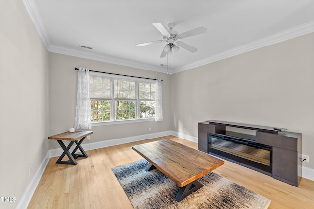 1221 Sagamore Dr, Louisburg, NC 27549 - living area with wood finished floors, ornamental molding, and ceiling fan