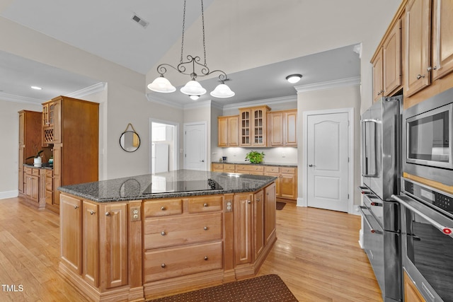 1221 Sagamore Dr, Louisburg, NC 27549 - kitchen featuring stainless steel appliances, light wood-style floors, glass insert cabinets, crown molding, and a center island