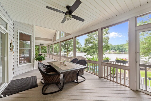 1221 Sagamore Dr, Louisburg, NC 27549 - sunroom with a water view, ceiling fan, outdoor dining area, and lofted ceiling