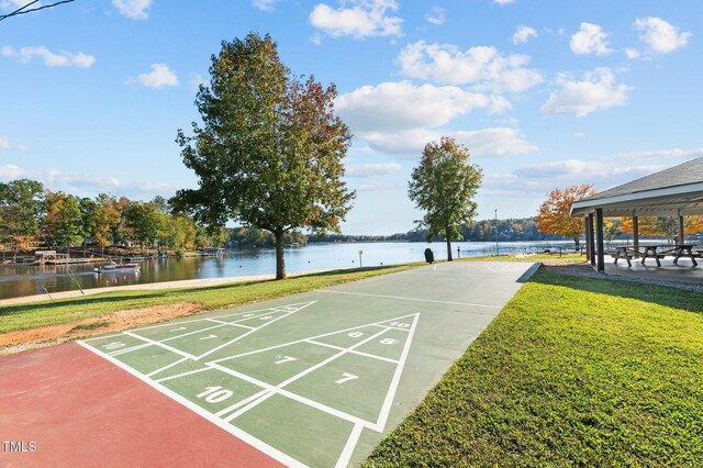 1221 Sagamore Dr, Louisburg, NC 27549 - view of home's community with a lawn, shuffleboard, and a water view