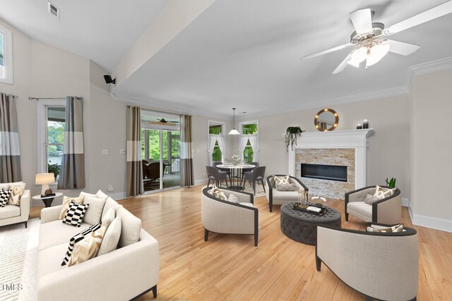 1221 Sagamore Dr, Louisburg, NC 27549 - living area with ceiling fan, a fireplace, light wood-type flooring, and ornamental molding
