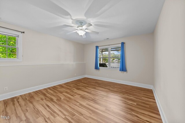 1221 Sagamore Dr, Louisburg, NC 27549 - unfurnished room featuring plenty of natural light, light wood finished floors, and a ceiling fan