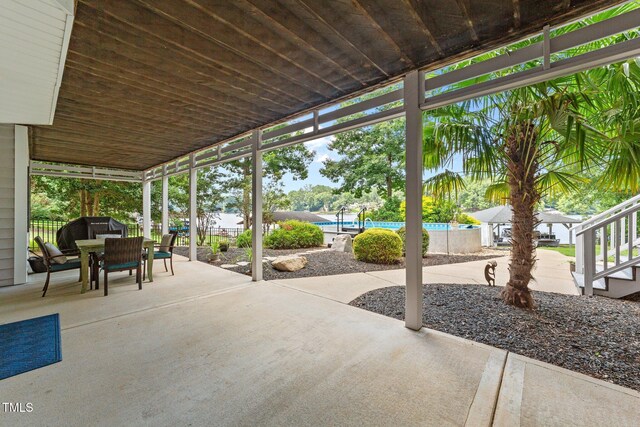 1221 Sagamore Dr, Louisburg, NC 27549 - view of patio featuring outdoor dining space and an outdoor pool