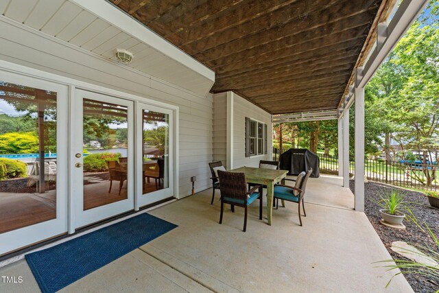 1221 Sagamore Dr, Louisburg, NC 27549 - view of patio / terrace featuring outdoor dining area, area for grilling, and french doors