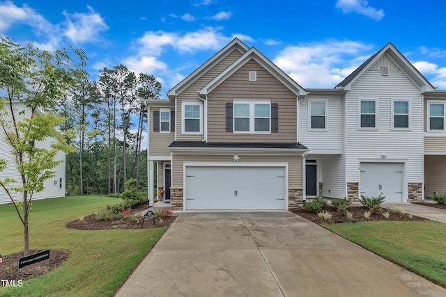 220 Garden Vine Trl, Raleigh, NC 27610 - view of front of property featuring stone siding, driveway, a garage, and a front yard