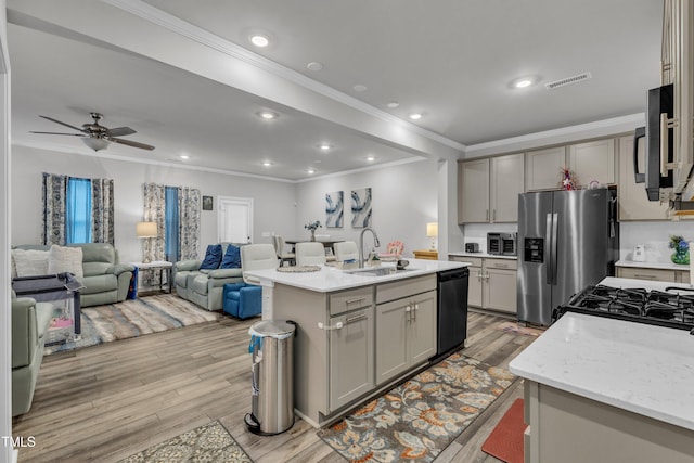 220 Garden Vine Trl, Raleigh, NC 27610 - kitchen featuring dishwasher, stainless steel fridge, ornamental molding, light wood finished floors, and gray cabinets