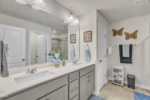 220 Garden Vine Trl, Raleigh, NC 27610 - bathroom featuring a stall shower, double vanity, and tile patterned flooring