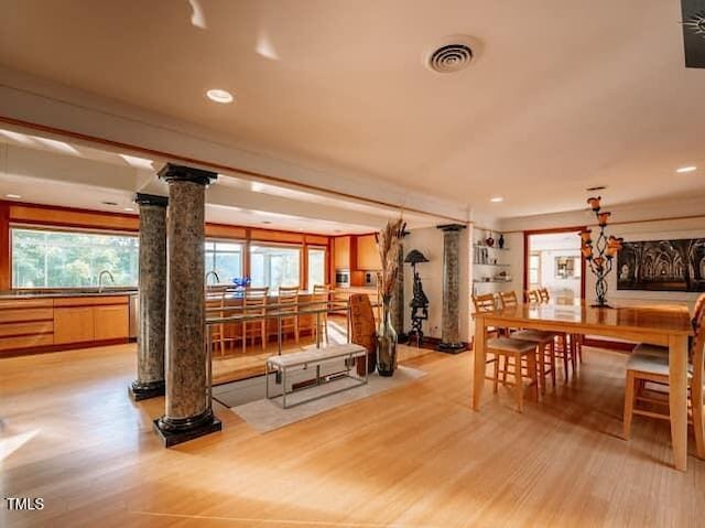 64 Robin Rd, Semora, NC 27343 - workout room with decorative columns, light wood-type flooring, healthy amount of natural light, and recessed lighting
