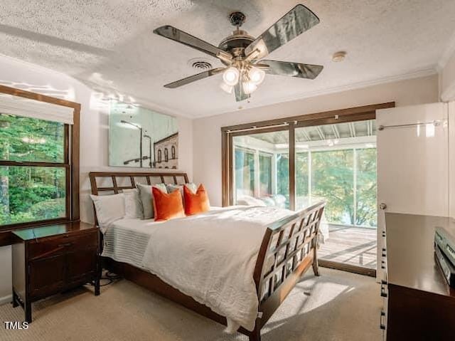 64 Robin Rd, Semora, NC 27343 - bedroom featuring access to outside, a textured ceiling, light colored carpet, ornamental molding, and a ceiling fan