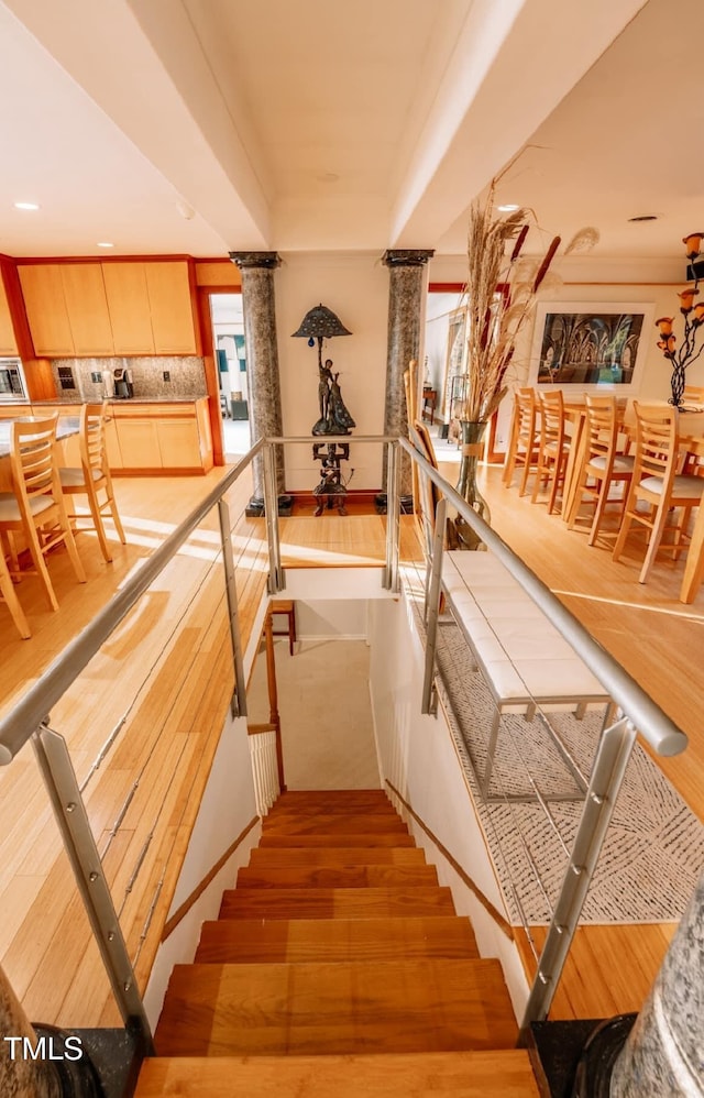 64 Robin Rd, Semora, NC 27343 - staircase with wood finished floors, recessed lighting, and decorative columns