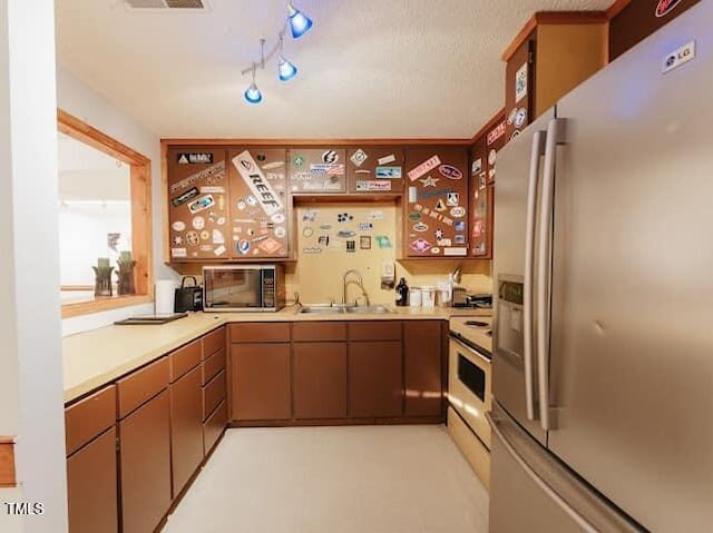64 Robin Rd, Semora, NC 27343 - kitchen featuring stainless steel refrigerator with ice dispenser, black microwave, light countertops, and white range