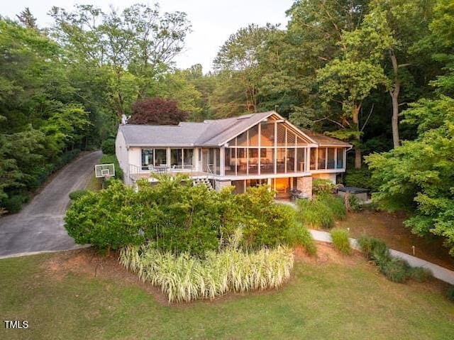 64 Robin Rd, Semora, NC 27343 - view of front facade with a sunroom and a wooded view
