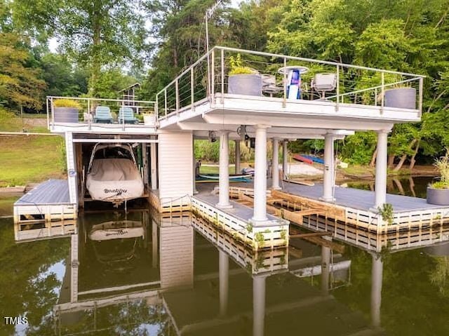 64 Robin Rd, Semora, NC 27343 - dock with boat lift, a water view, and view of scattered trees