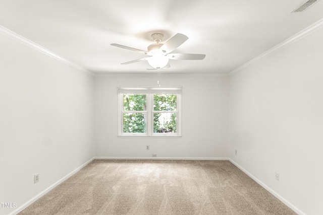 212 Heidinger Dr, Cary, NC 27511 - spare room featuring ceiling fan, light colored carpet, and ornamental molding