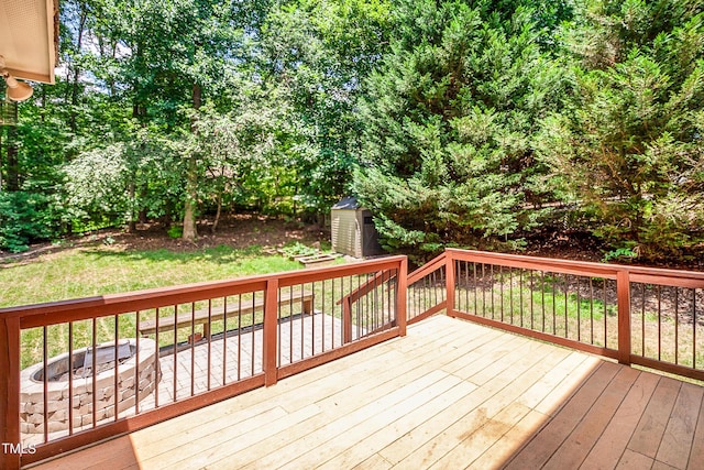 212 Heidinger Dr, Cary, NC 27511 - deck featuring a storage shed and a fire pit