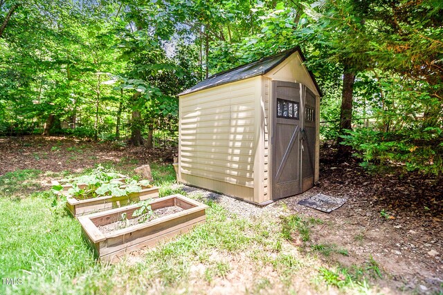 212 Heidinger Dr, Cary, NC 27511 - view of shed featuring a garden