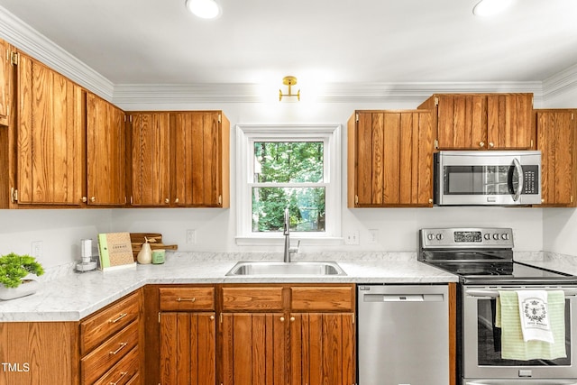 212 Heidinger Dr, Cary, NC 27511 - kitchen with stainless steel appliances, brown cabinets, light countertops, and ornamental molding