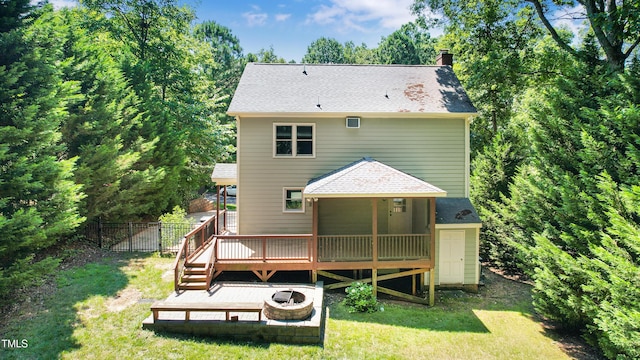 212 Heidinger Dr, Cary, NC 27511 - rear view of property featuring a chimney, a wooden deck, and roof with shingles