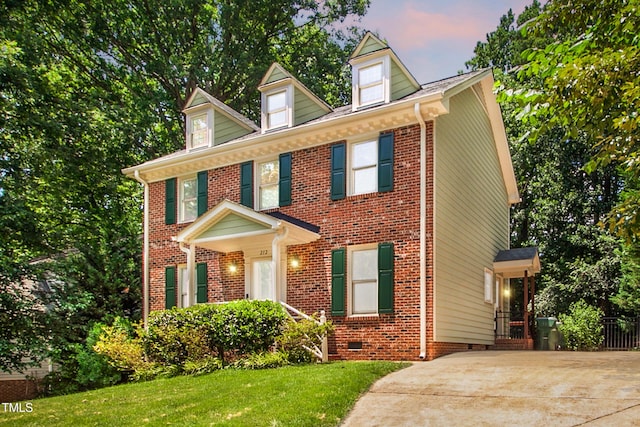 212 Heidinger Dr, Cary, NC 27511 - view of front facade with a front yard and brick siding