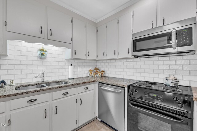 2003 Ryerson Dr, Garner, NC 27529 - kitchen with appliances with stainless steel finishes, light stone countertops, and backsplash