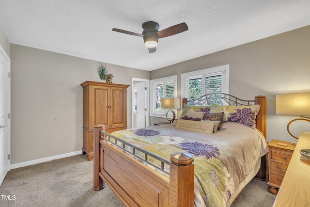 2003 Ryerson Dr, Garner, NC 27529 - bedroom with light carpet, ceiling fan, and a textured ceiling