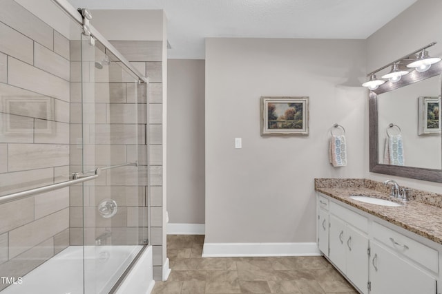 2003 Ryerson Dr, Garner, NC 27529 - full bathroom featuring vanity and bath / shower combo with glass door