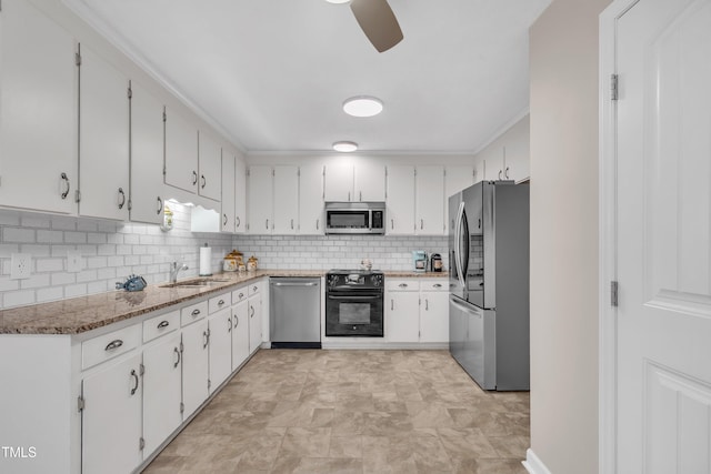 2003 Ryerson Dr, Garner, NC 27529 - kitchen featuring appliances with stainless steel finishes, decorative backsplash, ceiling fan, white cabinetry, and light stone counters