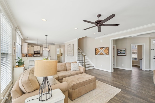 1985 Firenza Dr, Apex, NC 27502 - living room with a ceiling fan, stairway, recessed lighting, crown molding, and dark wood finished floors