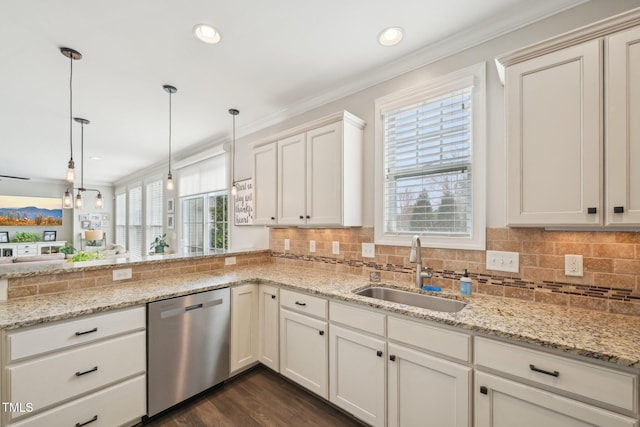1985 Firenza Dr, Apex, NC 27502 - kitchen with dishwasher, healthy amount of natural light, ornamental molding, backsplash, and recessed lighting