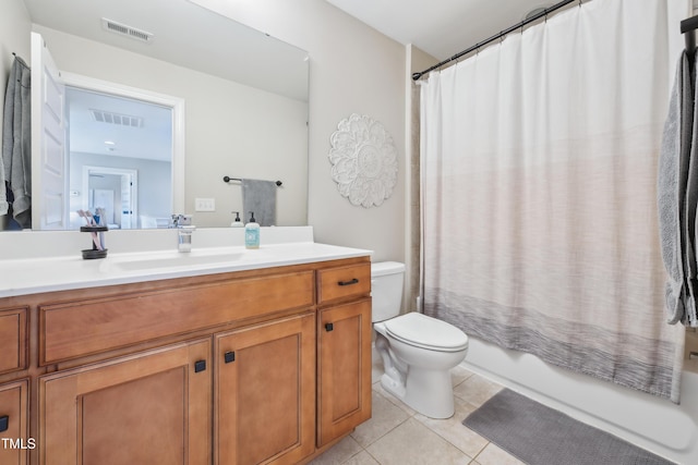 1985 Firenza Dr, Apex, NC 27502 - full bathroom featuring vanity, tile patterned flooring, and shower / tub combo with curtain