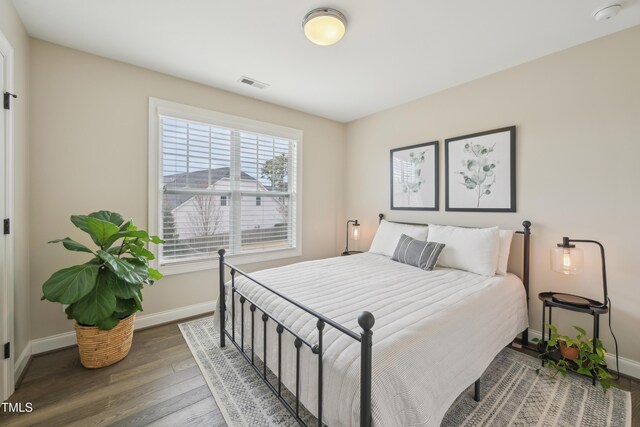 1985 Firenza Dr, Apex, NC 27502 - bedroom featuring baseboards and wood finished floors