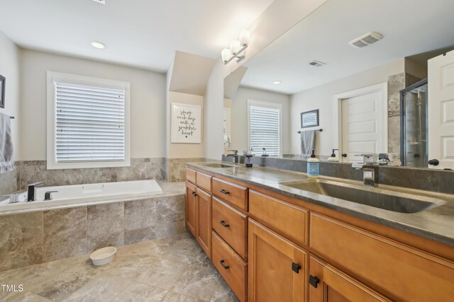 1985 Firenza Dr, Apex, NC 27502 - bathroom featuring a garden tub, double vanity, and a shower stall