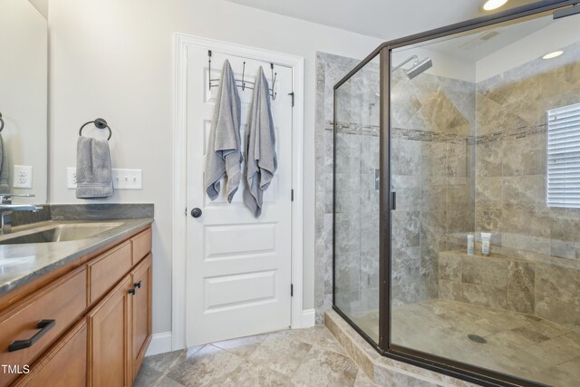 1985 Firenza Dr, Apex, NC 27502 - bathroom featuring vanity, a shower stall, and tile patterned floors