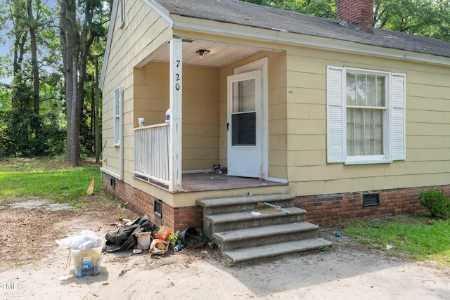 720 Spruce St, Laurinburg, NC 28352 - property entrance featuring crawl space and a chimney