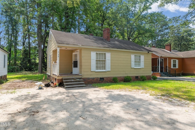 720 Spruce St, Laurinburg, NC 28352 - bungalow-style home featuring crawl space and a chimney