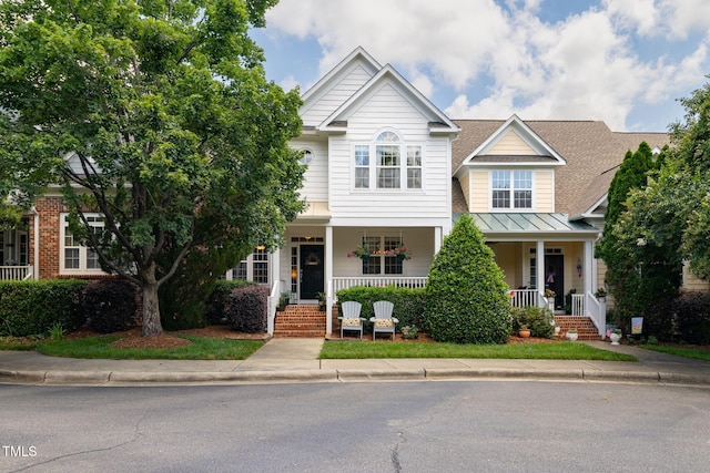 10906 Flower Bed Ct, Raleigh, NC 27614 - view of front of property with a porch, a standing seam roof, and a metal roof