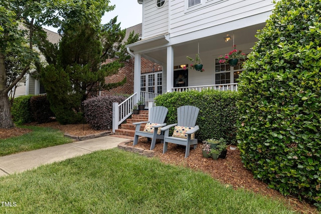 10906 Flower Bed Ct, Raleigh, NC 27614 - view of green lawn with covered porch
