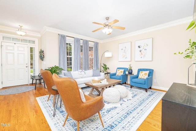 10906 Flower Bed Ct, Raleigh, NC 27614 - living room featuring light wood-style flooring, ornamental molding, and ceiling fan