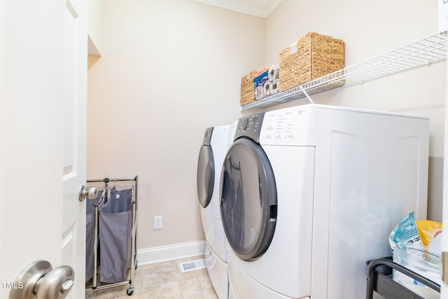 10906 Flower Bed Ct, Raleigh, NC 27614 - laundry area with washer and dryer and crown molding