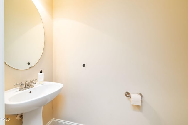 10906 Flower Bed Ct, Raleigh, NC 27614 - bathroom with a sink and baseboards