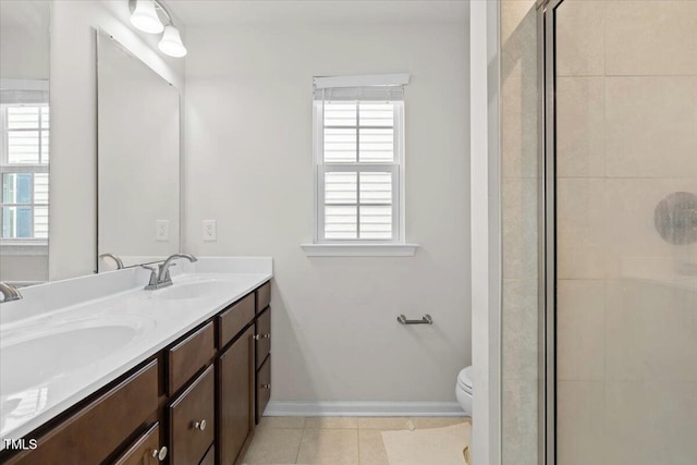 6620 Pathfinder Way, Raleigh, NC 27616 - bathroom featuring double vanity, a stall shower, and tile patterned floors