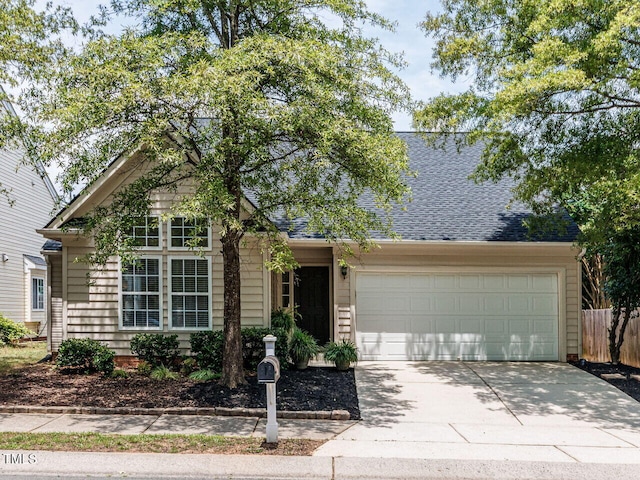1103 Mallory Ln, Durham, NC 27713 - view of front of house with concrete driveway, a garage, and a shingled roof