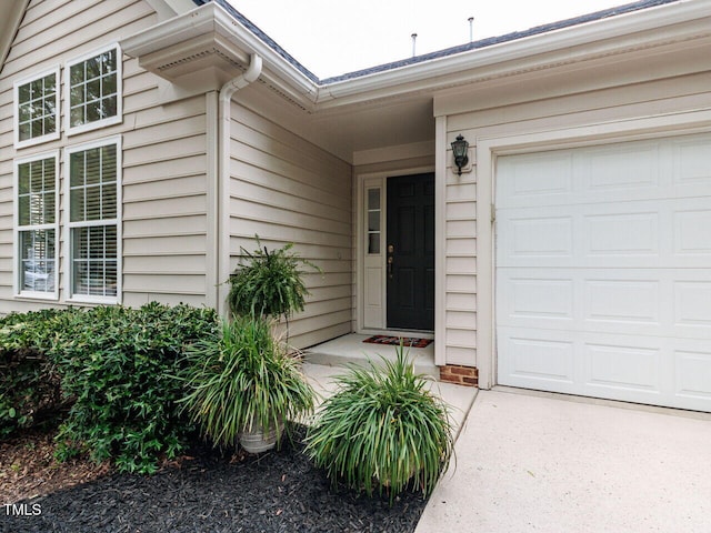 1103 Mallory Ln, Durham, NC 27713 - view of exterior entry with a garage