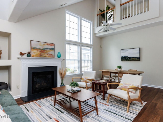 1103 Mallory Ln, Durham, NC 27713 - living area with ceiling fan, high vaulted ceiling, wood finished floors, and a glass covered fireplace