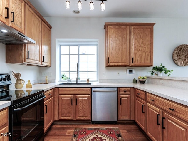 1103 Mallory Ln, Durham, NC 27713 - kitchen with black / electric stove, dishwasher, range hood, dark wood-type flooring, and light countertops