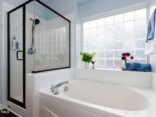 1103 Mallory Ln, Durham, NC 27713 - bathroom with a garden tub, a stall shower, and plenty of natural light