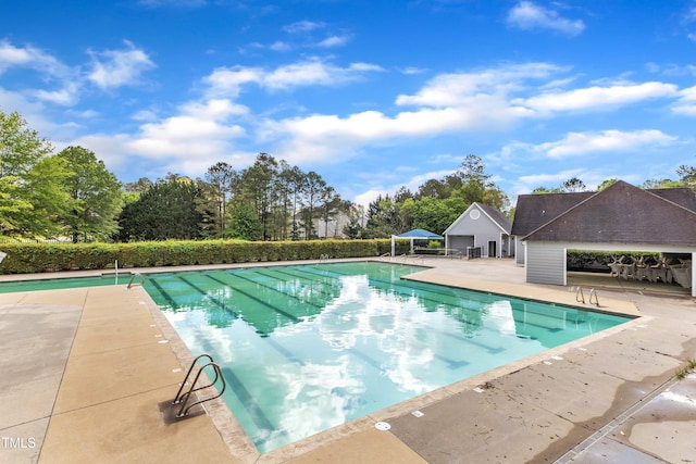 1103 Mallory Ln, Durham, NC 27713 - community pool featuring a patio and view of wooded area